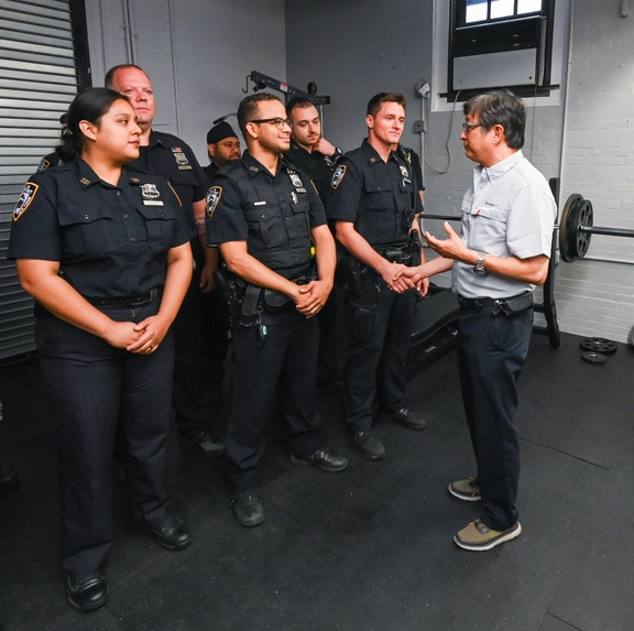 Wally Poon talking to NYPD officers