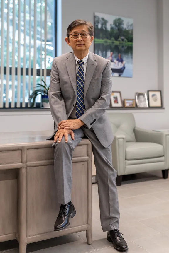 Wally Poon sitting in his office