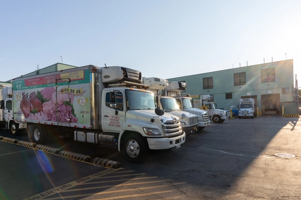 Way Fong trucks parked in front of the warehouse